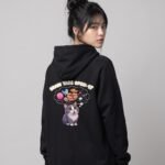 Back view of a woman wearing the black Distracted Keanu raglan hoodie by Keanu Organics