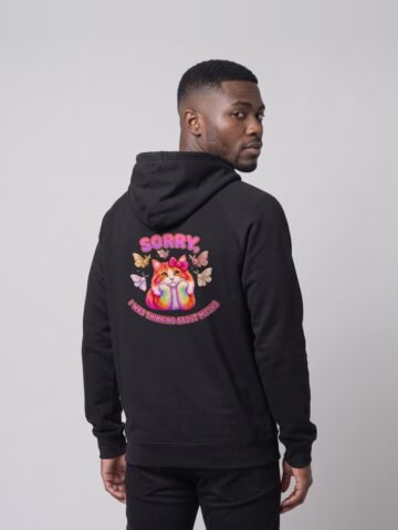 Back view of a man wearing the black Distracted Puddy Tat raglan hoodie by Keanu Organics