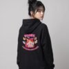 Back view of a woman wearing the black Distracted Puddy Tat raglan hoodie by Keanu Organics