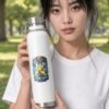 B Like Water Copper Bottle in white held by model in the park