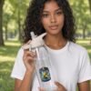 B Like Water Water Bottle held by model in the park