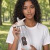 Mahavatar Keanu Blessing Bottle held by model in the park