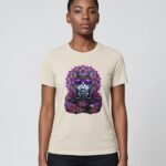 Woman wearing the oatmeal Mahavatar Keanu Ultra Tri-Blend Tee — Keanu in purple shades, paws together under a mandala halo