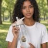 Mystic Mycelium Bottle held by model in the park