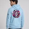 Man wearing the Blue Aqua Neon Heartbreak midweight hoodie with the neon heart design and black sleeve logo