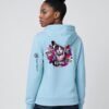 Woman wearing the Blue Aqua Neon Heartbreak midweight hoodie with the neon heart design and black sleeve logo