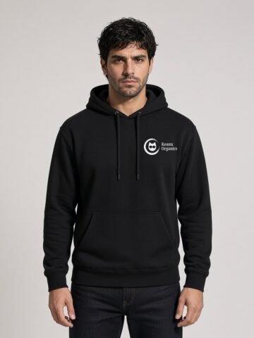 Man wearing the black Nine Lives Puddy Tat Midweight Hoodie with a white Keanu Organics chest logo