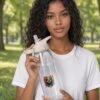 Prism Water Bottle held by model in the park
