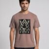 Man wearing the Kaffa Coffee Rooted in Patience Garment-Dyed Tee, front view